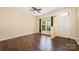 Inviting living room with a large window, wood floors, and a light-filled entryway at 4208 Carl Parmer Dr, Harrisburg, NC 28075