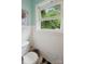 Cozy bathroom with white wainscoting and a classic black and white tiled floor at 4623 Drifter Dr # 30, Charlotte, NC 28227