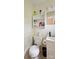 Compact bathroom featuring a toilet, sink, and storage cabinet, maximizing space at 4623 Drifter Dr # 30, Charlotte, NC 28227