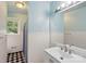 Bright bathroom featuring blue walls, a white vanity, and a classic design at 4623 Drifter Dr # 30, Charlotte, NC 28227