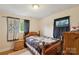 Inviting bedroom with natural light, a dresser, and a comfortable bed, perfect for rest at 4623 Drifter Dr # 30, Charlotte, NC 28227