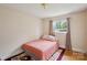 Bright bedroom with a window, hardwood floors, and a comfortable bed, perfect for relaxation at 4623 Drifter Dr # 30, Charlotte, NC 28227