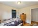 Simple bedroom featuring hardwood floors, a window, and a dresser, offering essential comfort at 4623 Drifter Dr # 30, Charlotte, NC 28227