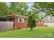Ranch-style brick home with lush landscaping and well-maintained lawn at 4623 Drifter Dr # 30, Charlotte, NC 28227