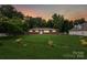 View of a brick home with a spacious yard, showcasing its peaceful and private setting at 4623 Drifter Dr # 30, Charlotte, NC 28227
