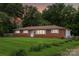 Charming brick home with a well-maintained lawn and minimal landscaping at 4623 Drifter Dr # 30, Charlotte, NC 28227