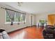 Spacious living room with hardwood floors, large windows, and comfortable seating at 4623 Drifter Dr # 30, Charlotte, NC 28227
