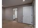 Bedroom with carpeted floors and white door that leads into the ensuite bathroom at 4920 Morrison Houser Trl # 2, Lincolnton, NC 28092