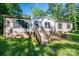 Inviting single-story home with wooden front porch stairs and a well-maintained lawn, perfect for outdoor relaxation at 4920 Morrison Houser Trl # 2, Lincolnton, NC 28092