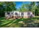 Well-maintained home with black shutters, a cozy front porch, and a neatly kept lawn, offering a welcoming curb appeal at 4920 Morrison Houser Trl # 2, Lincolnton, NC 28092