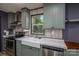View of the kitchen sink area featuring modern appliances and farmhouse-style sink at 4920 Morrison Houser Trl # 2, Lincolnton, NC 28092