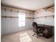 Bright home office with a classic desk, comfortable chair, and built-in shelving for optimal storage solutions at 4920 Morrison Houser Trl # 2, Lincolnton, NC 28092
