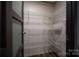 Walk-in pantry with metal shelving for ample storage and easy organization of household goods at 4920 Morrison Houser Trl # 2, Lincolnton, NC 28092