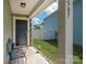 Inviting front porch with seating area and view of the landscaped yard at 507 Newfound Hollow Dr, Charlotte, NC 28214