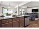 Modern kitchen boasts granite countertops, stainless steel appliances, and a seamless flow to the living area at 507 Newfound Hollow Dr, Charlotte, NC 28214
