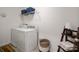 Functional laundry room features a washer, dryer, shelving and stylish decor at 507 Newfound Hollow Dr, Charlotte, NC 28214