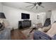 Well-lit living space with comfortable sofa and view of staircase and entryway at 507 Newfound Hollow Dr, Charlotte, NC 28214