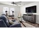 Comfortable living area with sofa, entertainment center, and a large window at 507 Newfound Hollow Dr, Charlotte, NC 28214