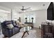 Cozy living room with plush seating, ceiling fan, and lots of natural light at 507 Newfound Hollow Dr, Charlotte, NC 28214