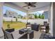 Covered patio features an outdoor seating area and a view of the fenced backyard at 507 Newfound Hollow Dr, Charlotte, NC 28214