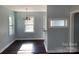 Bright dining room featuring hardwood floors and modern lighting fixtures at 523 Franklin Ave, Charlotte, NC 28206