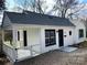 Cozy home featuring a fenced-in front yard and well-manicured landscaping at 523 Franklin Ave, Charlotte, NC 28206
