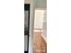 Functional hallway with hardwood floors and modern stacked washer and dryer at 523 Franklin Ave, Charlotte, NC 28206