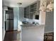 Functional kitchen with granite countertops and stainless steel refrigerator at 523 Franklin Ave, Charlotte, NC 28206