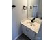 Bathroom featuring single sink vanity with white countertop and black hardware at 5637 Hedgecrest Pl, Charlotte, NC 28269