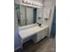 Bathroom featuring single sink vanity with white countertop and black hardware at 5637 Hedgecrest Pl, Charlotte, NC 28269