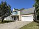 Charming two-story home featuring a front porch, attached garage, and well-maintained lawn at 5637 Hedgecrest Pl, Charlotte, NC 28269