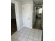 Welcoming foyer with tile flooring and an open view into the kitchen with stainless steel appliances at 5637 Hedgecrest Pl, Charlotte, NC 28269