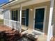 Inviting front porch showcasing white railings and blue shutters for a cozy welcome at 5637 Hedgecrest Pl, Charlotte, NC 28269