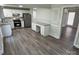 Open concept kitchen featuring granite countertops, stainless steel appliances, and hardwood floors at 5637 Hedgecrest Pl, Charlotte, NC 28269