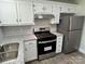Updated kitchen featuring white cabinets, granite countertops, stainless steel appliances, and modern backsplash at 5637 Hedgecrest Pl, Charlotte, NC 28269