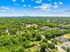An aerial view showcasing lush greenery and the skyline of Uptown Charlotte, which is just minutes away at 6012 Tuckaseegee Rd, Charlotte, NC 28208