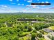 An aerial view showcasing lush greenery and the skyline of Uptown Charlotte, which is just minutes away at 6012 Tuckaseegee Rd, Charlotte, NC 28208
