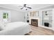 Bright bedroom featuring neutral walls, a fireplace and great lighting at 6012 Tuckaseegee Rd, Charlotte, NC 28208