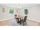 Bright dining room featuring a stylish round table and comfortable seating near sunny windows at 6012 Tuckaseegee Rd, Charlotte, NC 28208