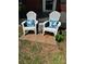 Front porch featuring cozy white Adirondack chairs with comfy pillows at 6012 Tuckaseegee Rd, Charlotte, NC 28208