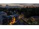 Scenic aerial shot showcasing modern townhouses with the downtown skyline in the distance, captured at twilight at 614 Queens Rd, Charlotte, NC 28207