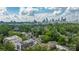 Stunning aerial view of the city skyline and a charming neighborhood with mature trees at 614 Queens Rd, Charlotte, NC 28207