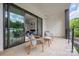 Inviting outdoor balcony with sliding glass doors, comfortable seating, and scenic views at 614 Queens Rd, Charlotte, NC 28207