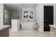 Contemporary bathroom features a standalone tub, glass shower, and modern fixtures at 614 Queens Rd, Charlotte, NC 28207