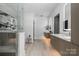 Modern bathroom features dual sinks, a walk-in glass shower, and contemporary finishes at 614 Queens Rd, Charlotte, NC 28207