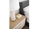 Close-up on a bedroom nightstand with lamp and decorative box, highlighting the attention to detail at 614 Queens Rd, Charlotte, NC 28207