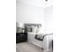 Tastefully decorated bedroom with a plush headboard, stylish nightstand, and soft lighting, offering a relaxing retreat at 614 Queens Rd, Charlotte, NC 28207