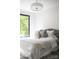Bright bedroom featuring a large window and neutral decor, creating a calm and inviting atmosphere at 614 Queens Rd, Charlotte, NC 28207