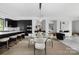 Open concept dining area featuring a designer light fixture, kitchen island, and modern decor at 614 Queens Rd, Charlotte, NC 28207