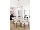Bright dining room with a glass-top table, seating for six, and modern chandelier at 614 Queens Rd, Charlotte, NC 28207